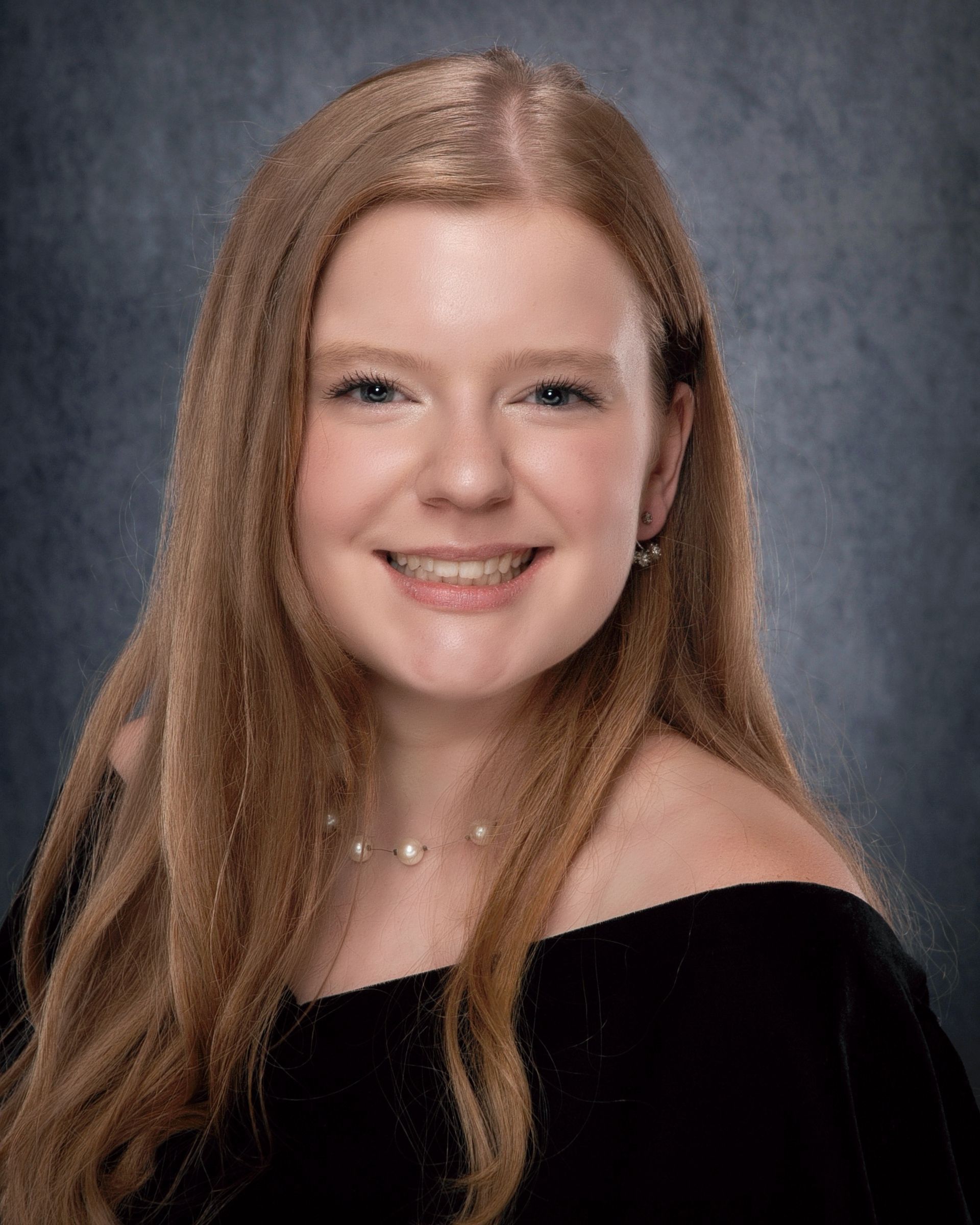 Young woman with long blonde hair, smiling