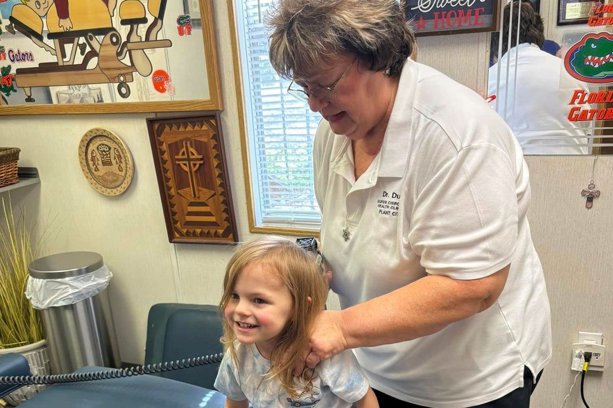 Dr. Dukes examining a young patient.