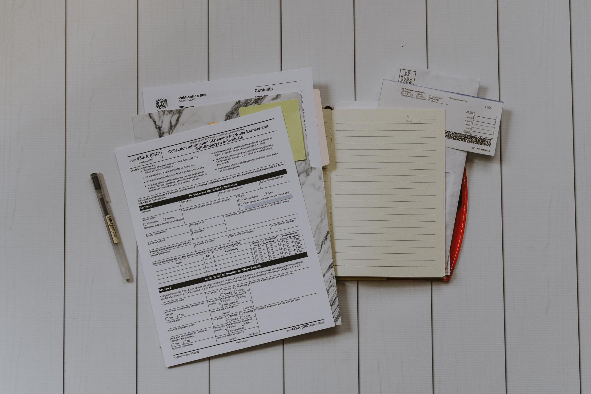 Tax forms and papers piled together