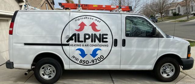 A white van with alpine heating and air conditioning written on it