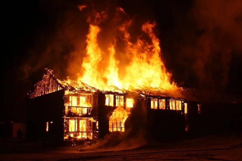 House burning at night.