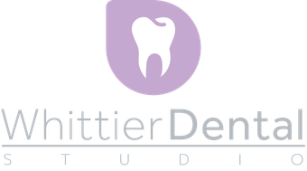 A tooth in a purple circle on a white background.