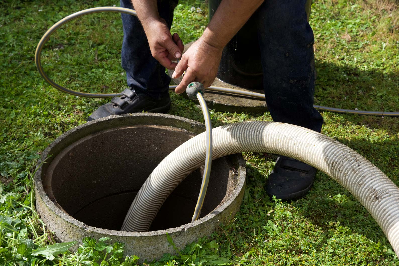 Man currently cleaning the septic tank — Woodstock, GA — Richards Septic Tank Service LLC