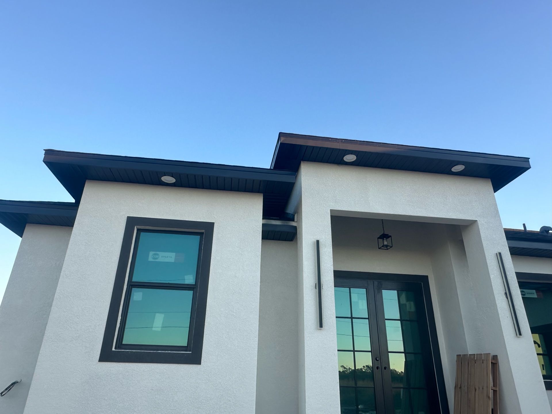 A white house with a blue sky in the background