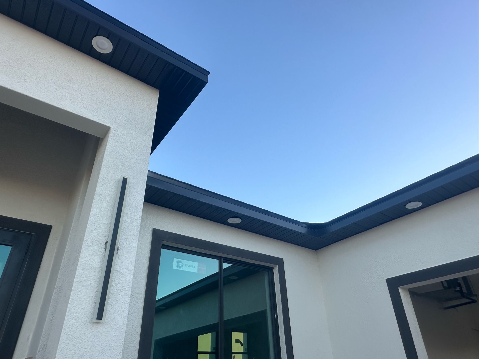 Looking up at a house with a blue sky in the background