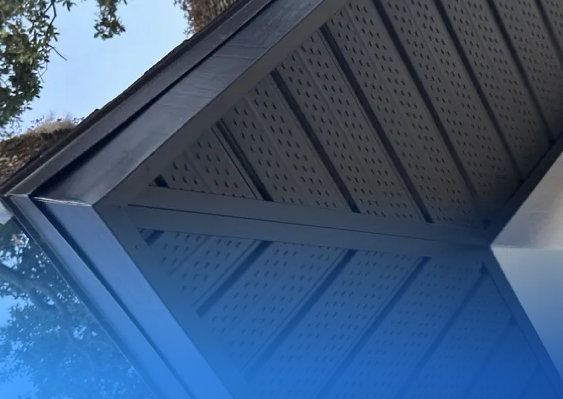 A roof with a blue sky in the background