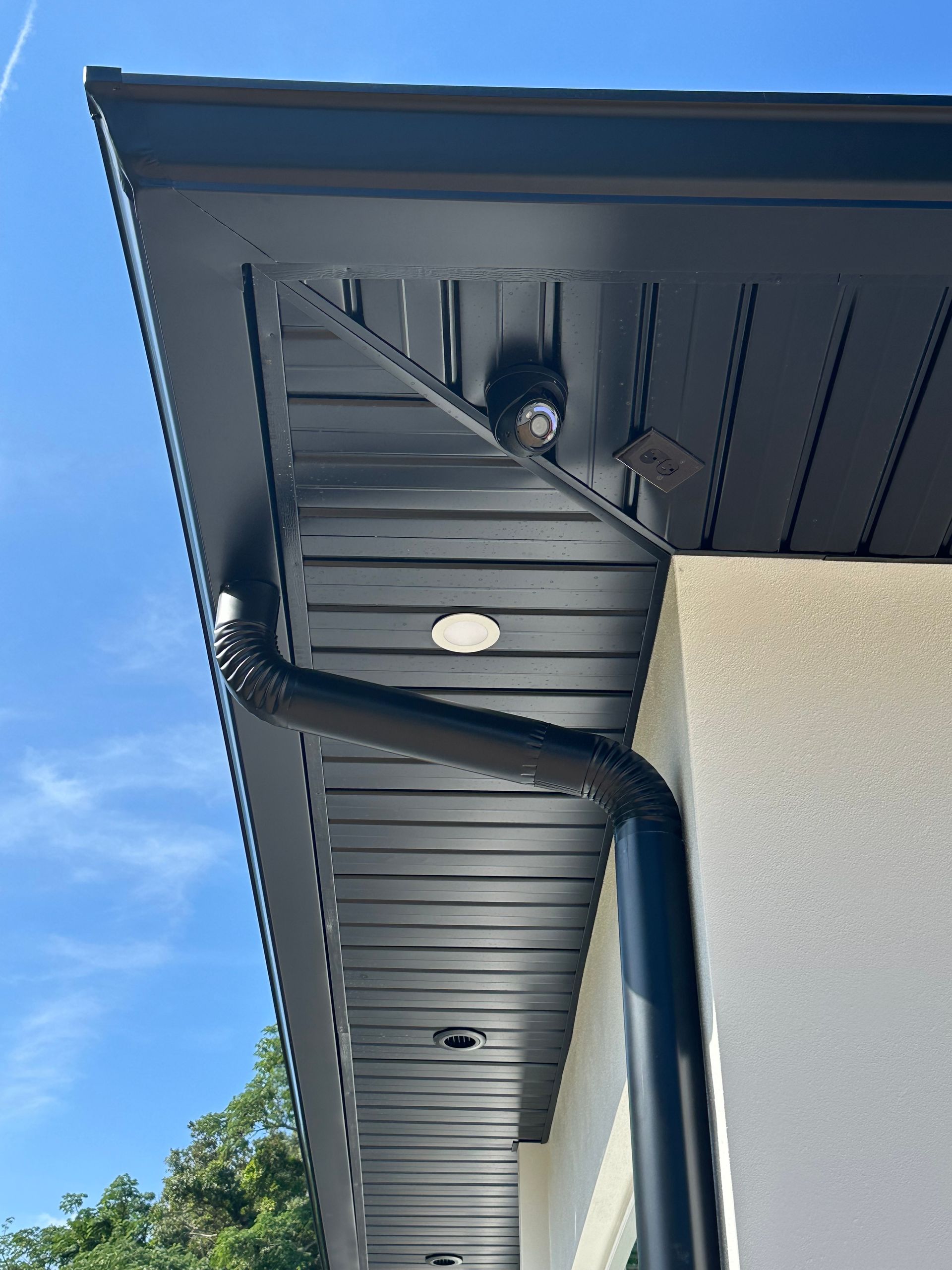 A man is using a drill to drill a hole in a piece of metal.