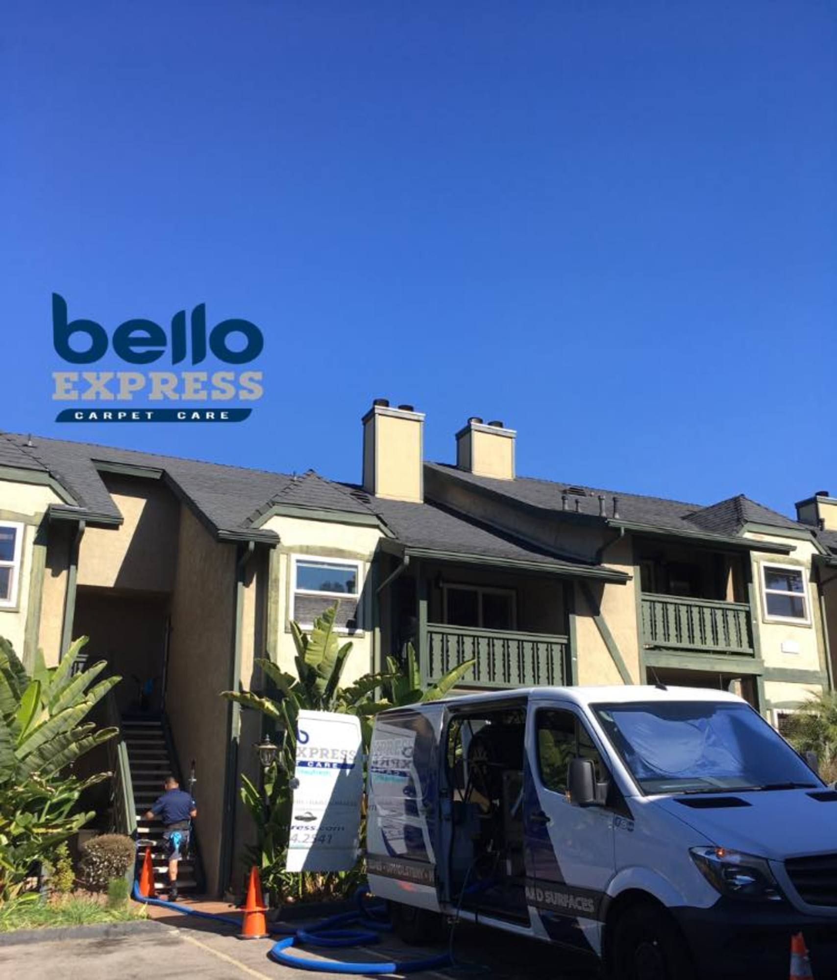 A bello express van is parked in front of a building