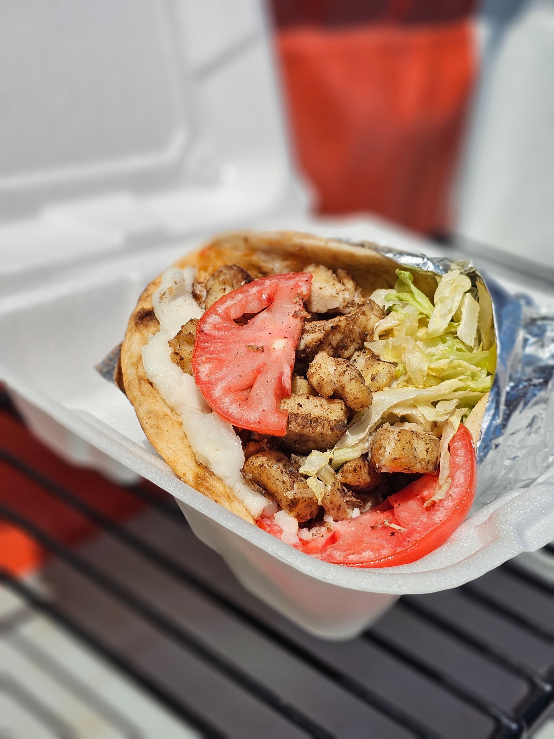 A white plate topped with meat and french fries.