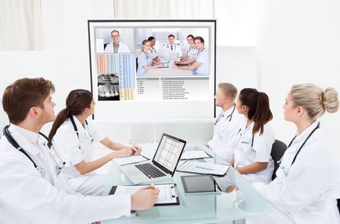 Clinicians participating in a video conference.