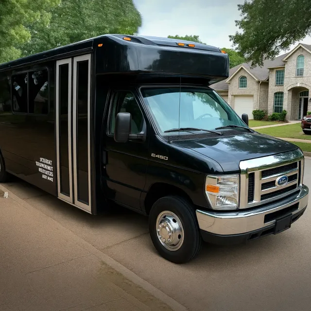 Black party bus parked on a residential street.