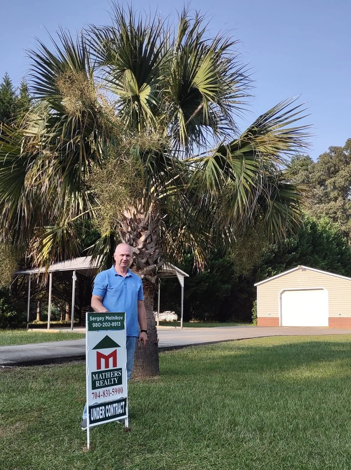 Palm trees and landscaped yard near Charlotte NC home