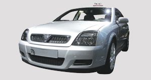 A large white taxi cab