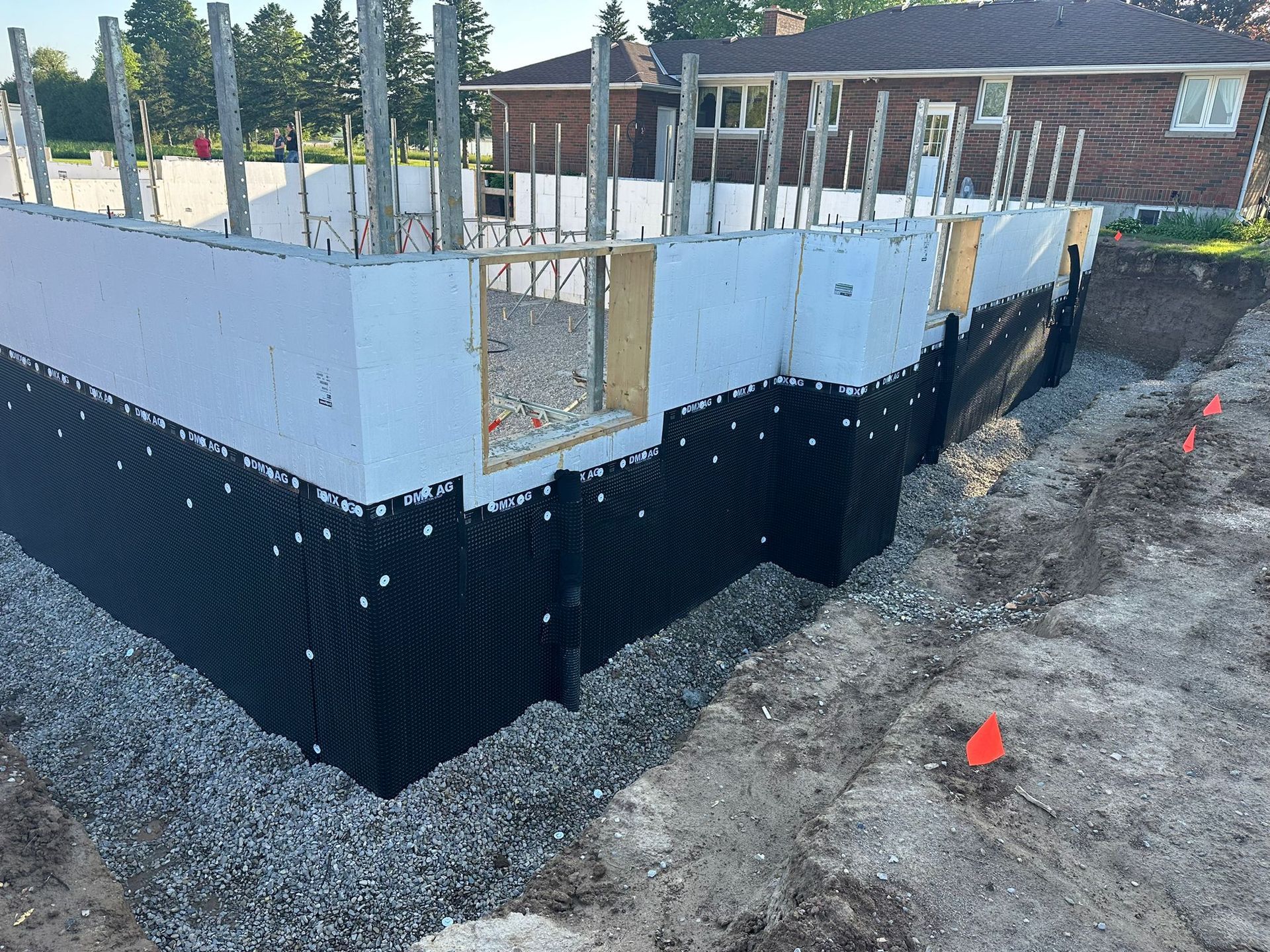 An ICF construction site with waterproofing material installed.