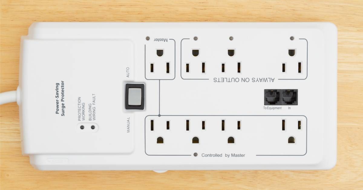 A white surge protector extension strip with eight electrical outlets 