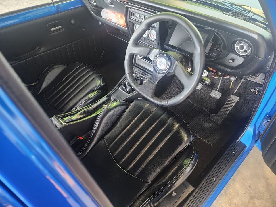 The Interior Of A Blue Car With Black Seats And A Steering Wheel — M8S Rates Mechanical In Gladstone Central, QLD