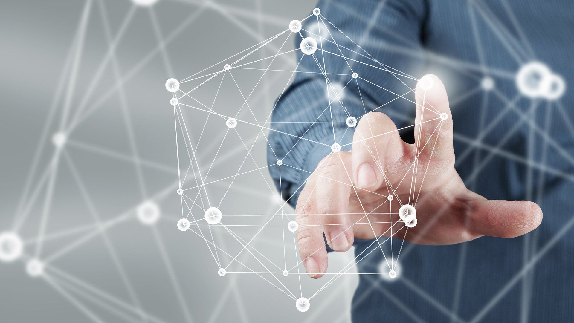 A close up of a person 's hand pressing a button on a screen.