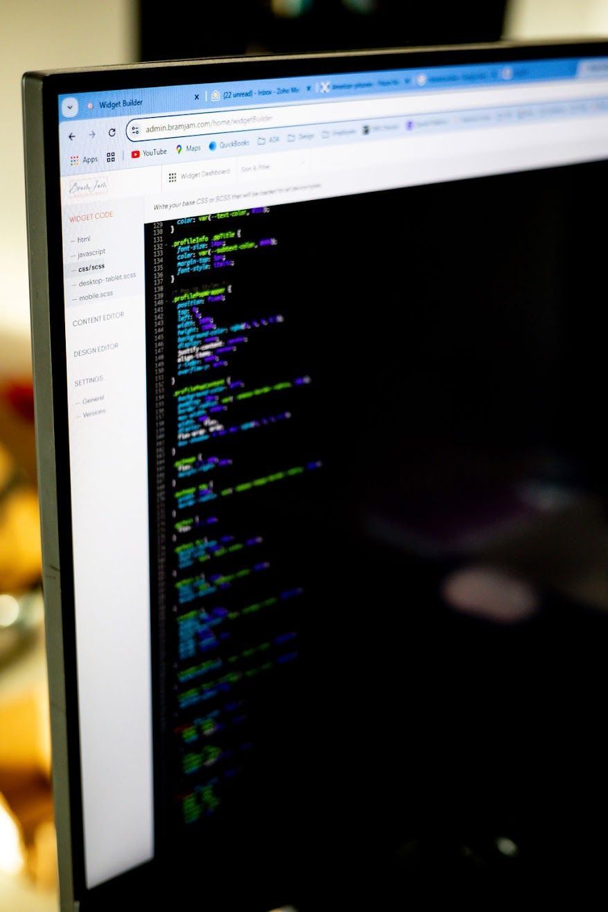 Computer screen displaying lines of colorful code.