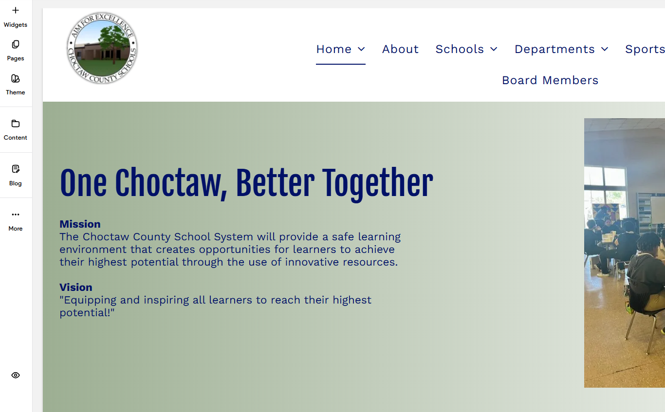 Website for Mayville Community Schools with building and cloudy sky, with admissions button.