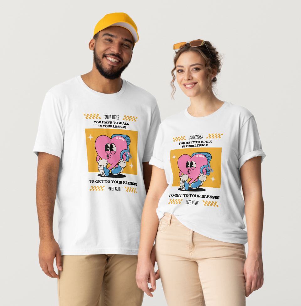 Two people wearing white t-shirts with cartoon heart design, smiling.