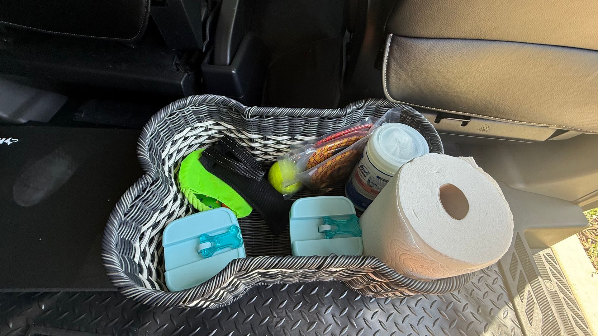 A basket with a roll of toilet paper in it