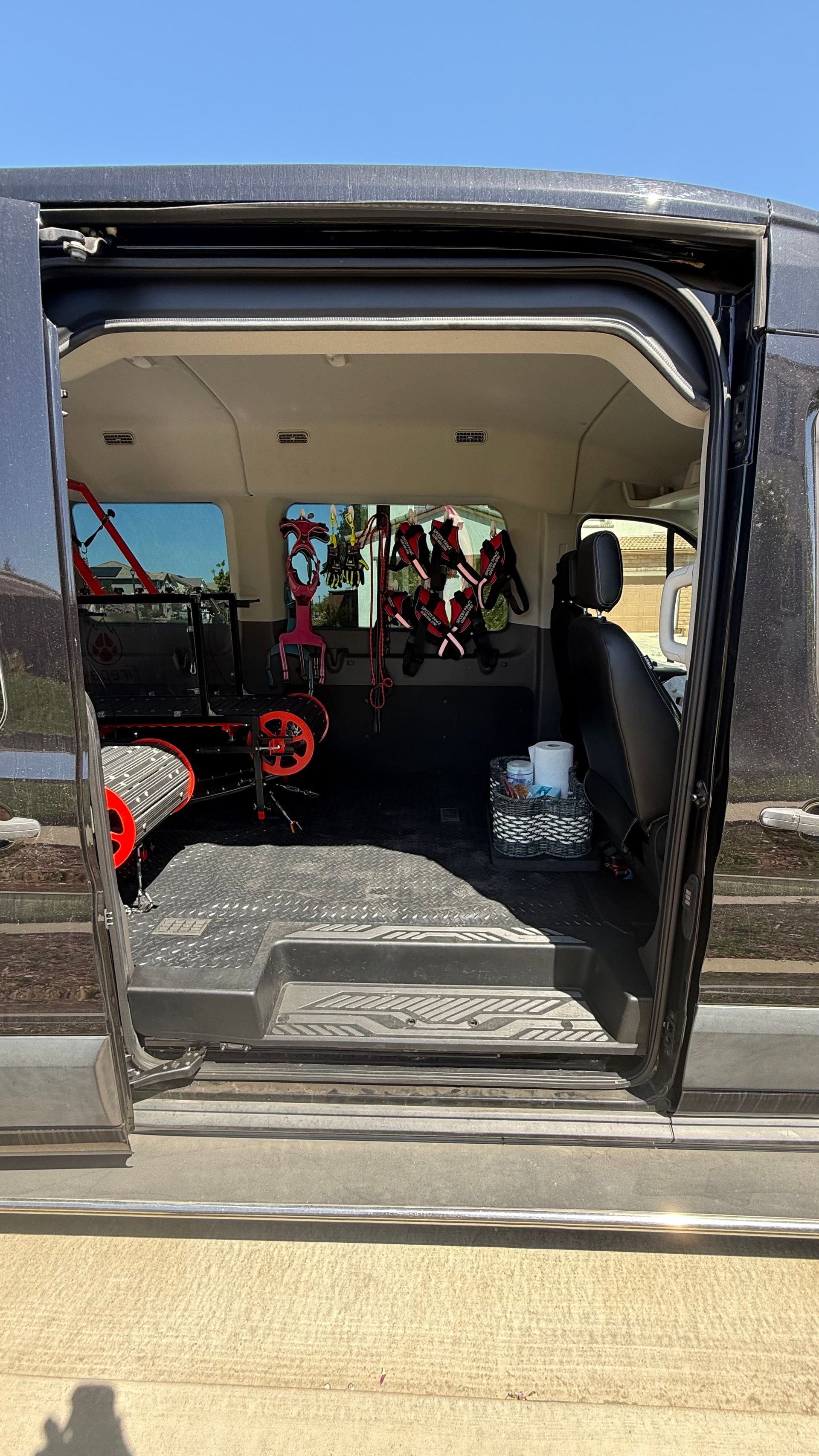 The back of a jeep with the door open.