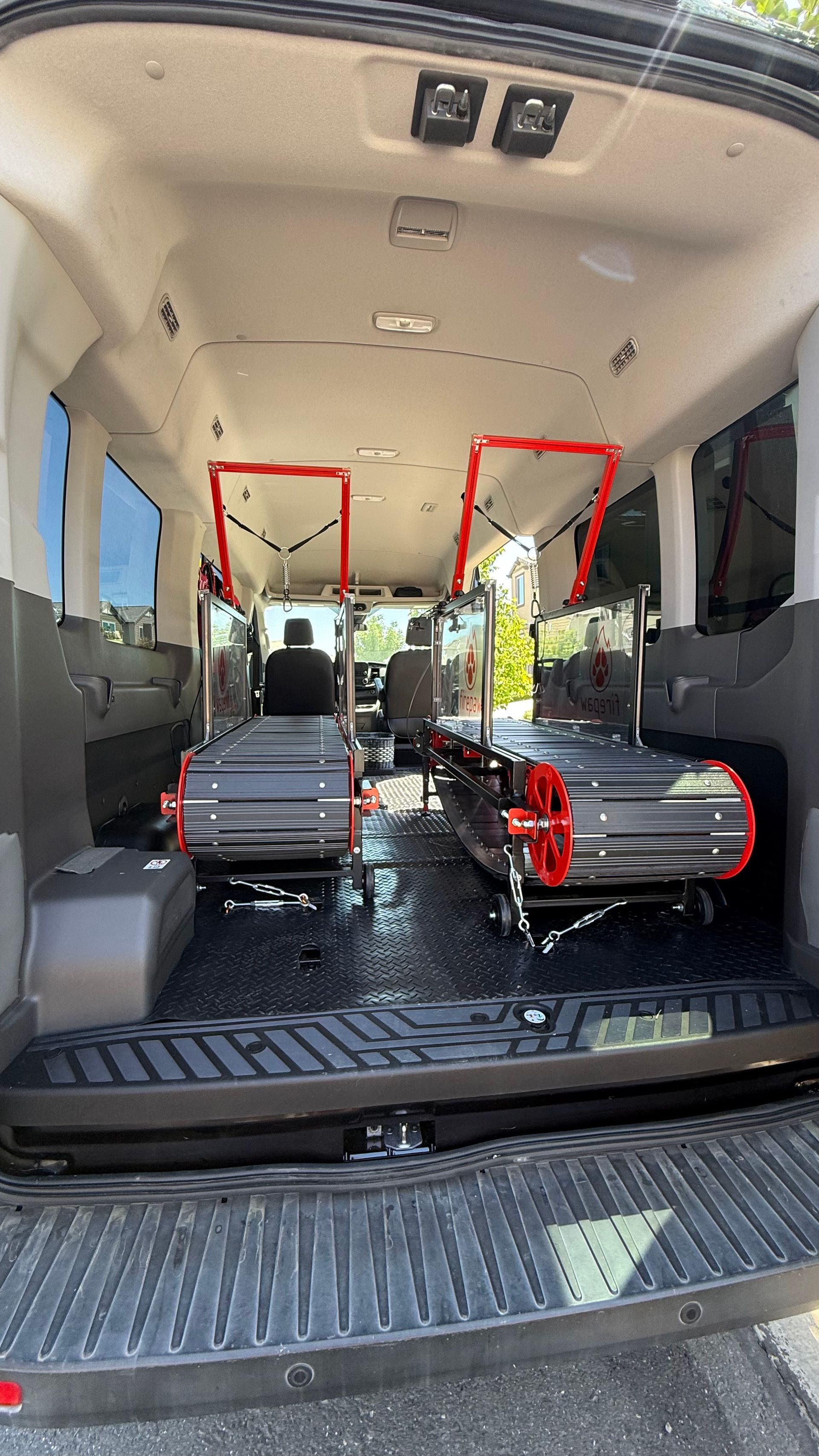 The back of an ambulance with two beds in it.