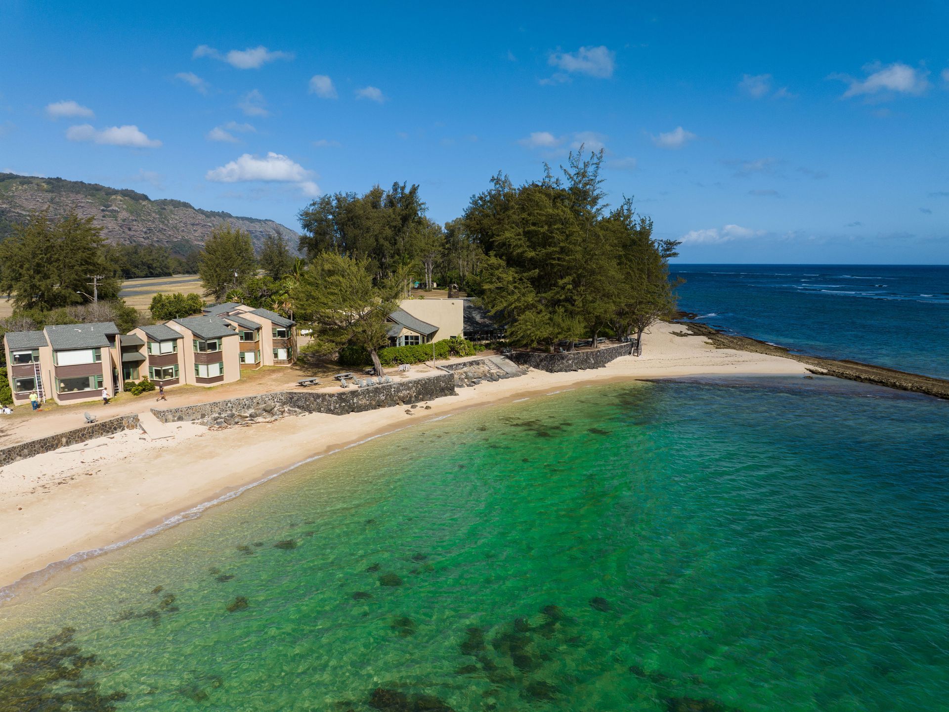 An aerial view of a small island in the middle of the ocean.