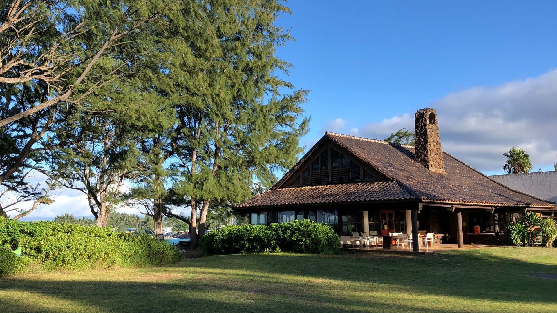 A large house with a large lawn in front of it