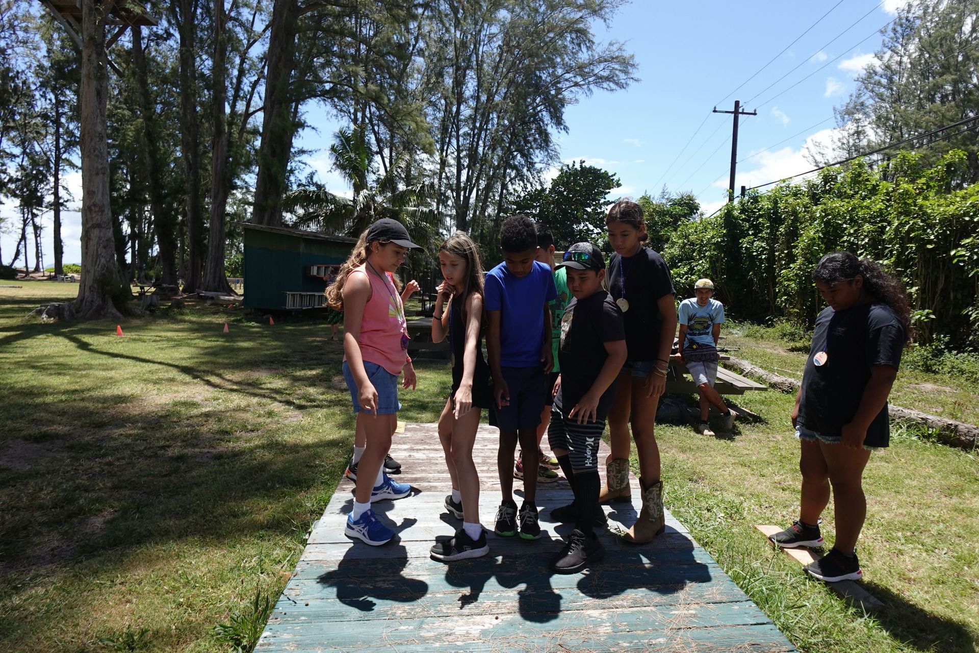 A group of people are in a raft in the ocean