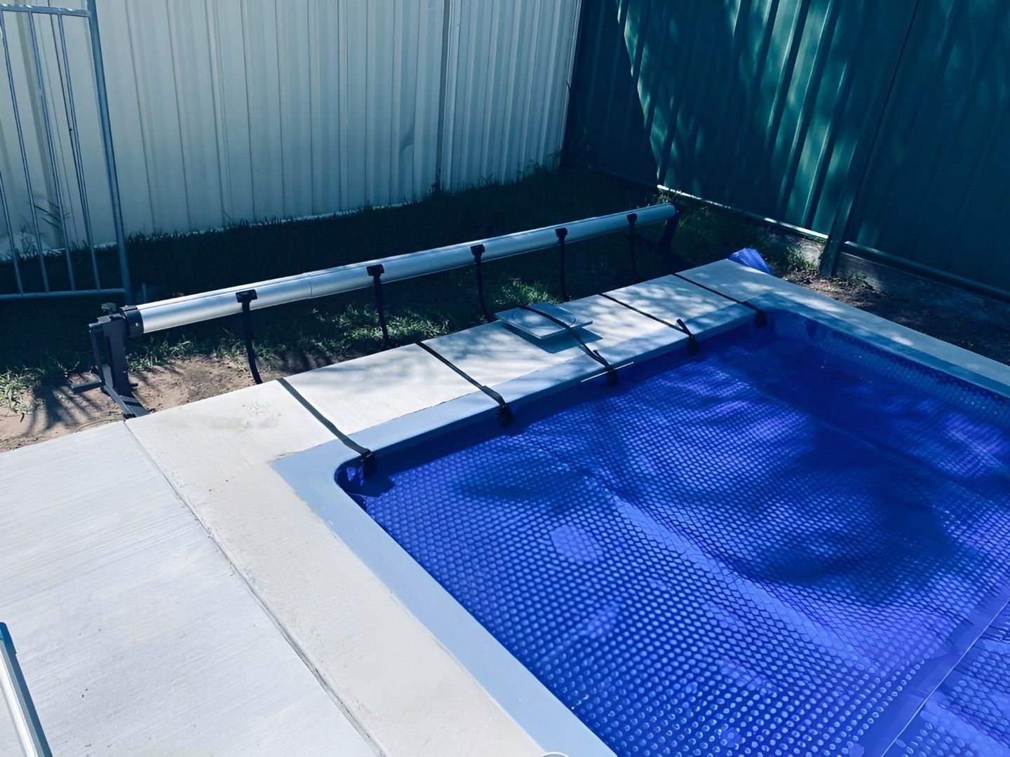 Pool With Blue Cover in Backyard — Tempshift Pool Heating in Buff Point, NSW