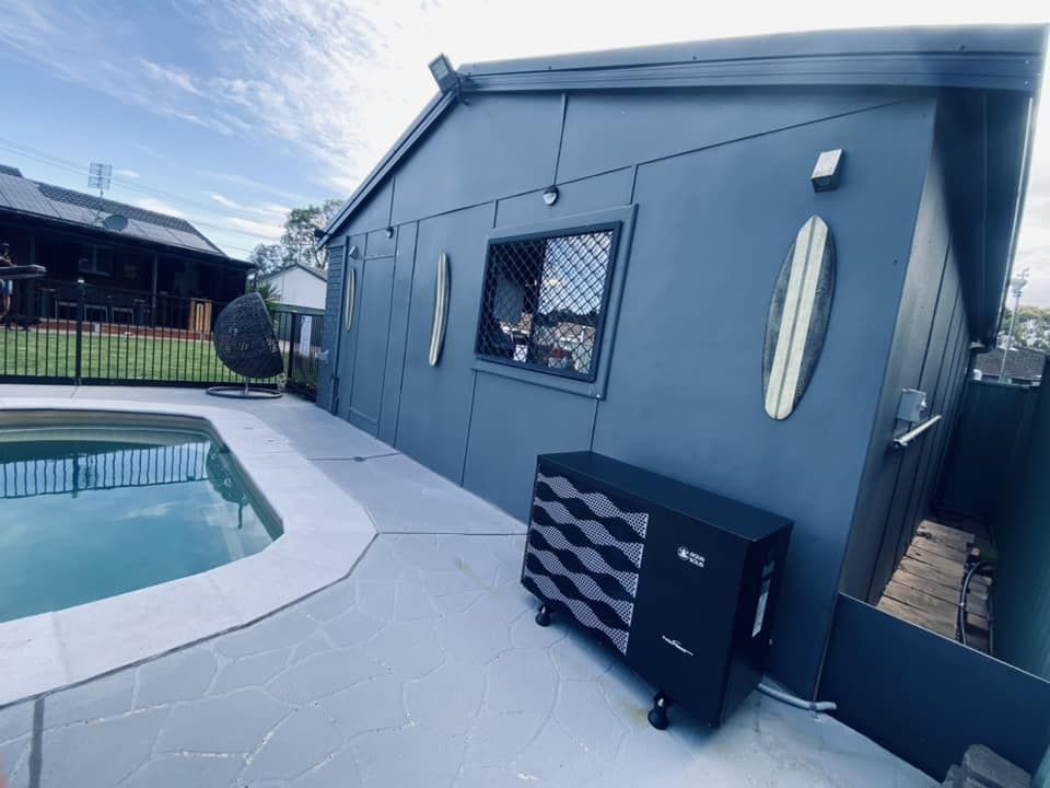 Blue Building With a Pool, and a Pool Heater Outside — Tempshift Pool Heating in Gosford, NSW