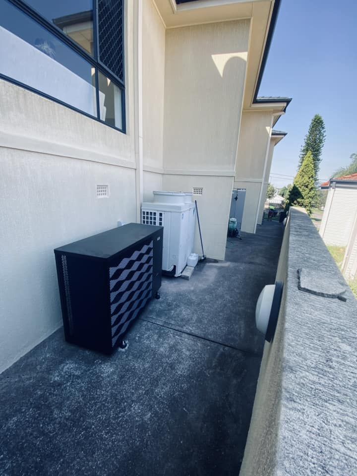 A Narrow Concrete Walkway Along a Building Exterior — Tempshift Pool Heating in Buff Point, NSW