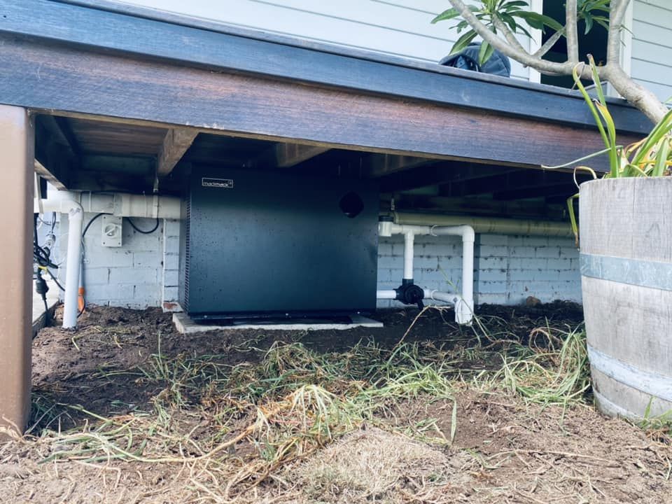 Dark-Colored Pool Heater Beneath a Wooden Deck — Tempshift Pool Heating in Hunter Valley, NSW