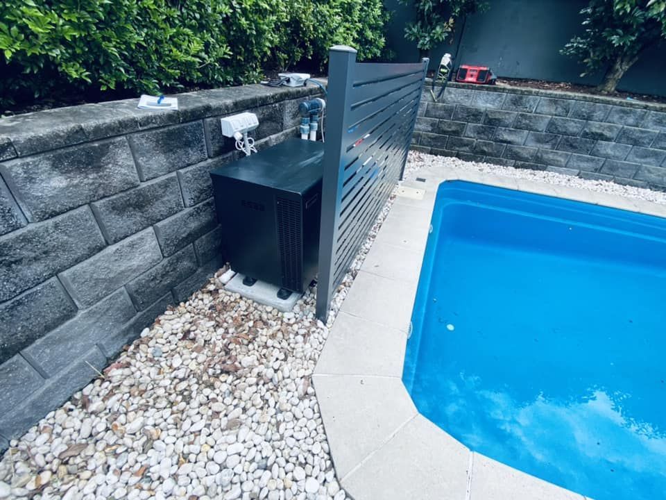 Black Pool Heater Next to a Blue Pool — Tempshift Pool Heating in Central Coast, NSW