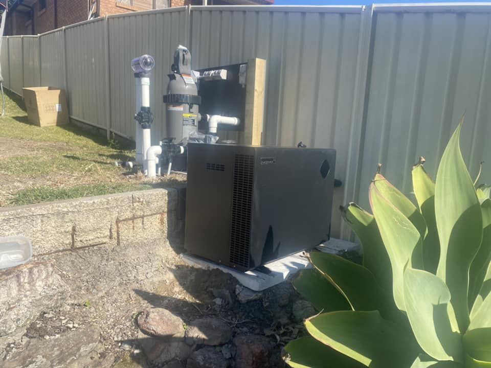 A Pool Pump and Filtration System Against a Fence — Tempshift Pool Heating in Buff Point, NSW