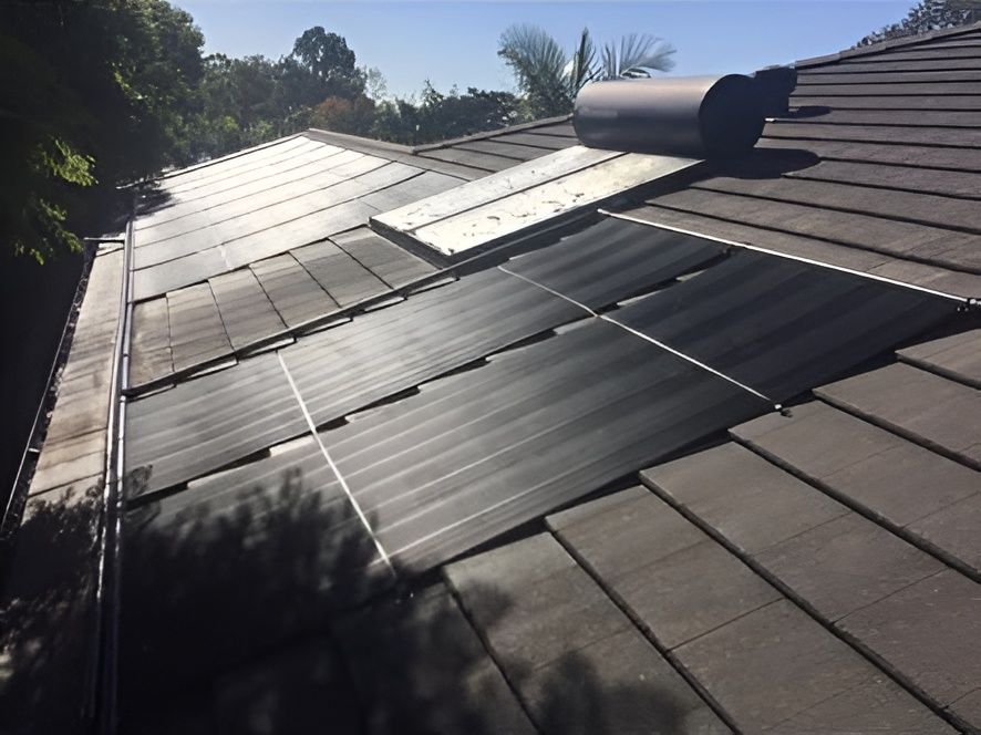 Solar Panels Installed on a Tiled Roof, With a Water Heater — Tempshift Pool Heating in Newcastle, NSW