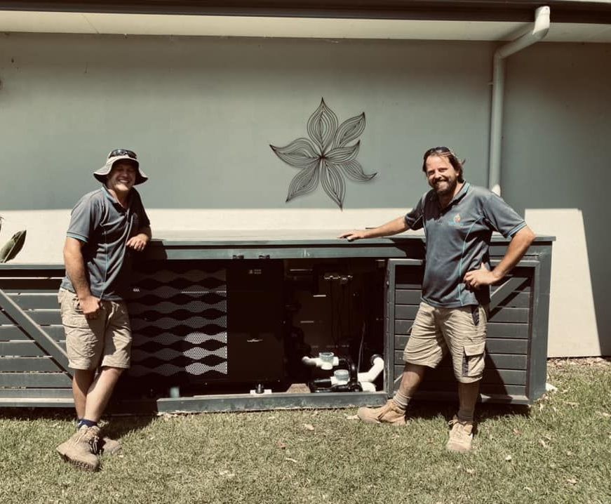 Two Men Are Smiling in a Yard — Tempshift Pool Heating in Buff Point, NSW