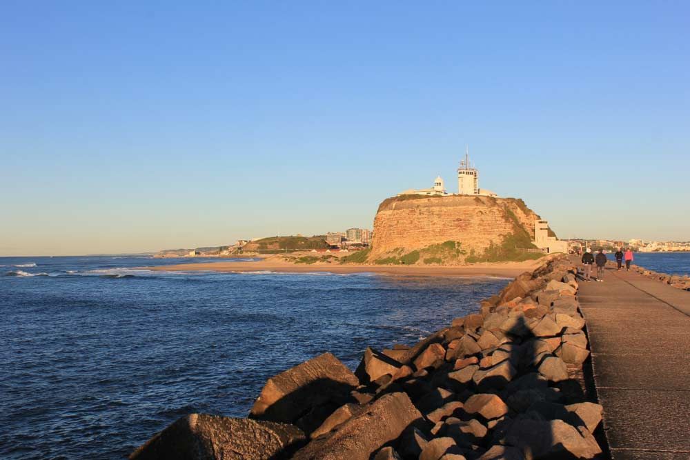 Ocean View With a Lighthouse on a Cliff — Tempshift Pool Heating in Newcastle, NSW
