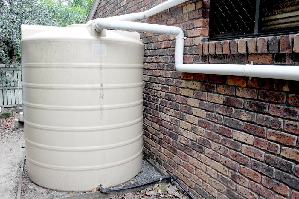 Plastic Water Tank Attached to the House — Rainman Domestic Water in Avoca, QLD