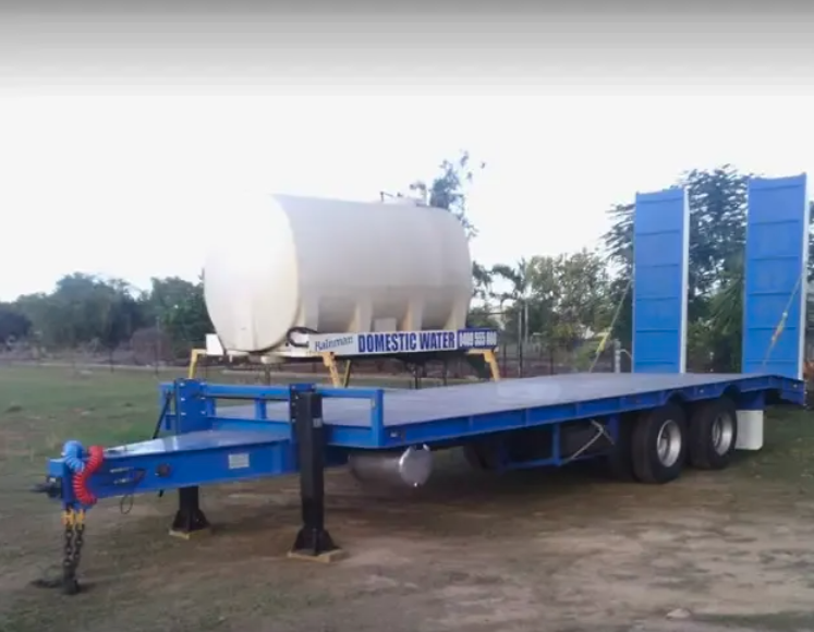 Water Truck Pours the Road with Water — Rainman Domestic Water in Avoca, QLD