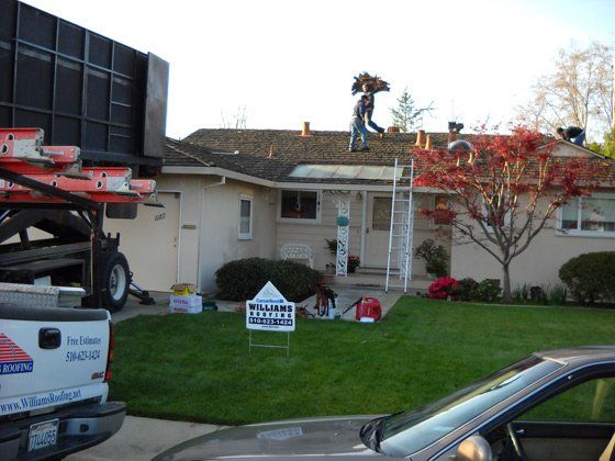 Commercial Roofing — Man on top of the Roof in Fremont, CA
