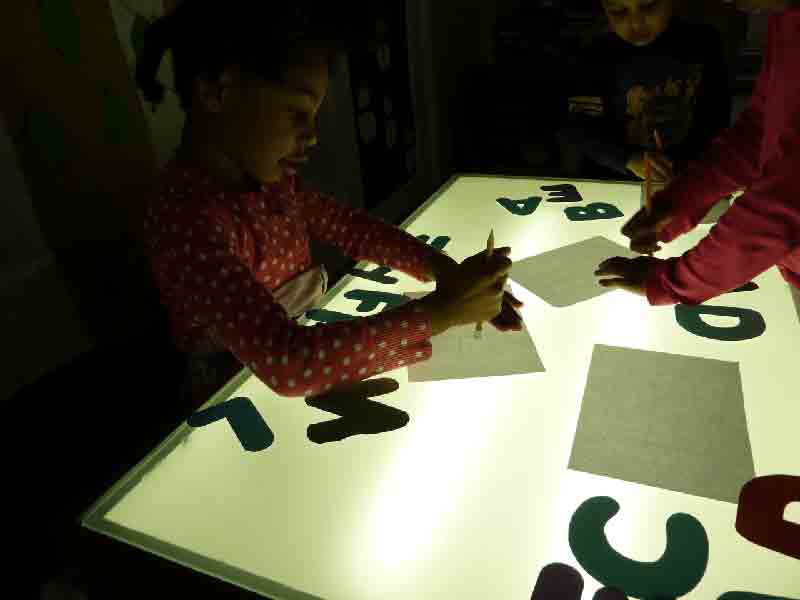 Children tracing the letters - Preschool in Beaverton, OR