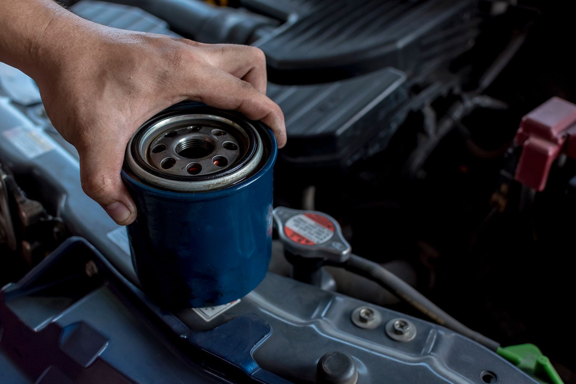 Premium Amsoil oil change component Ea filter next to labeled box showing brand and product formula.