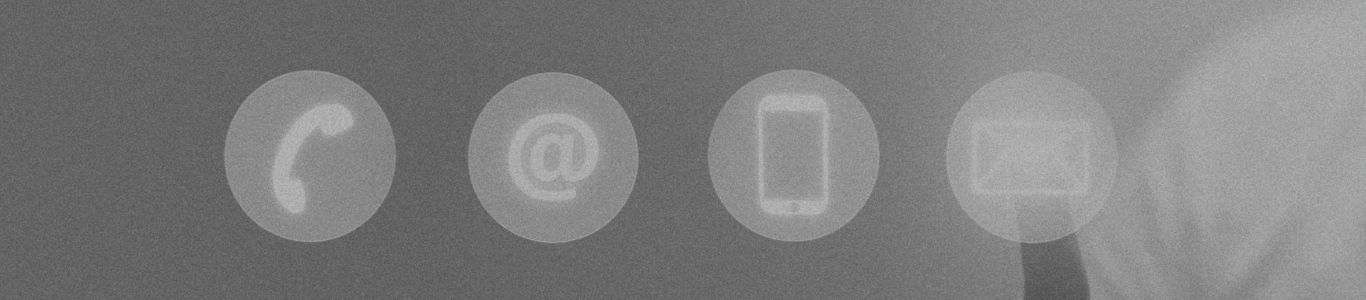 A black and white photo of four icons on a wall.