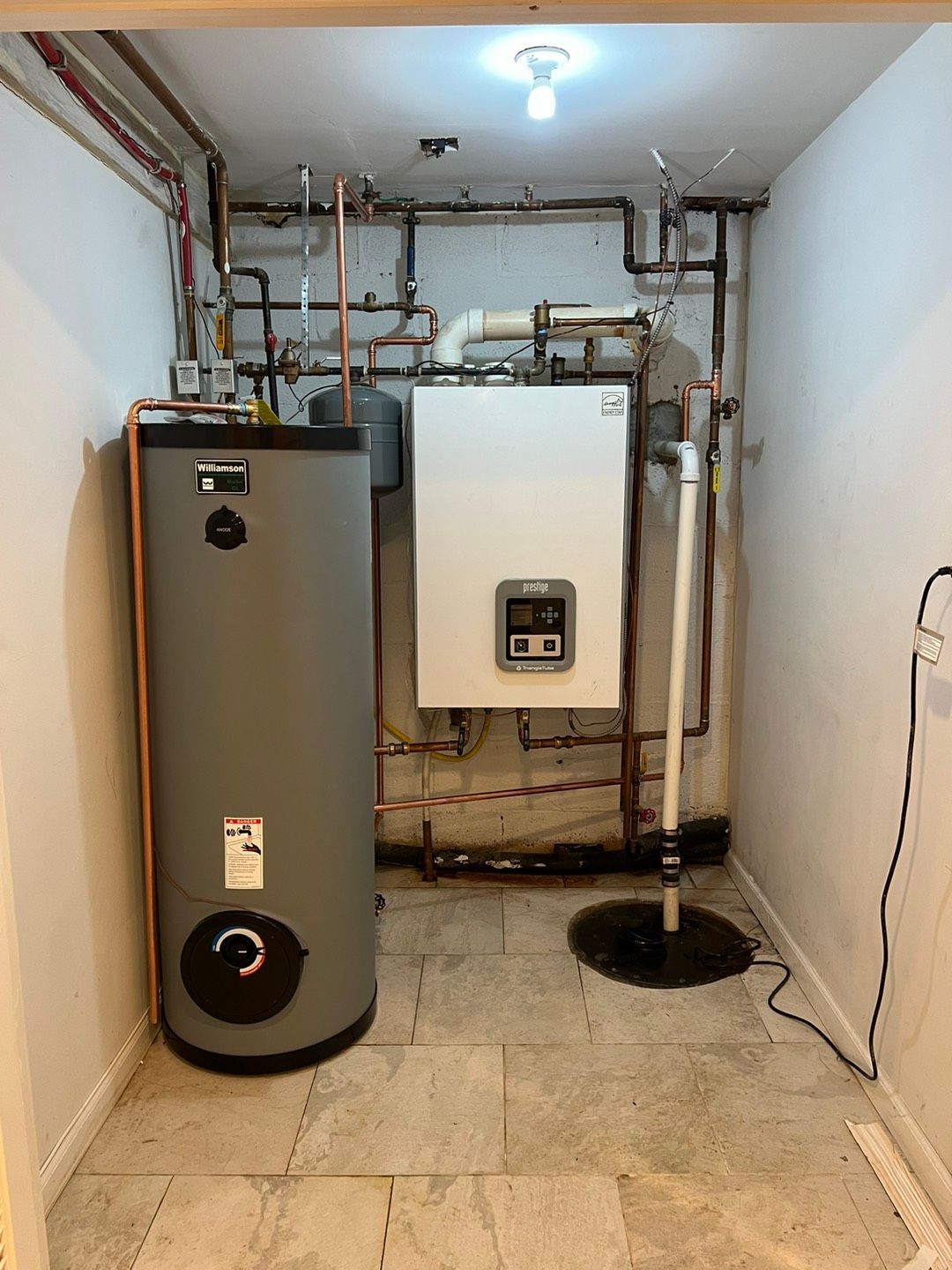 Room with a grey boiler and pipes - Lafayette, NJ | Clear Water Solutions