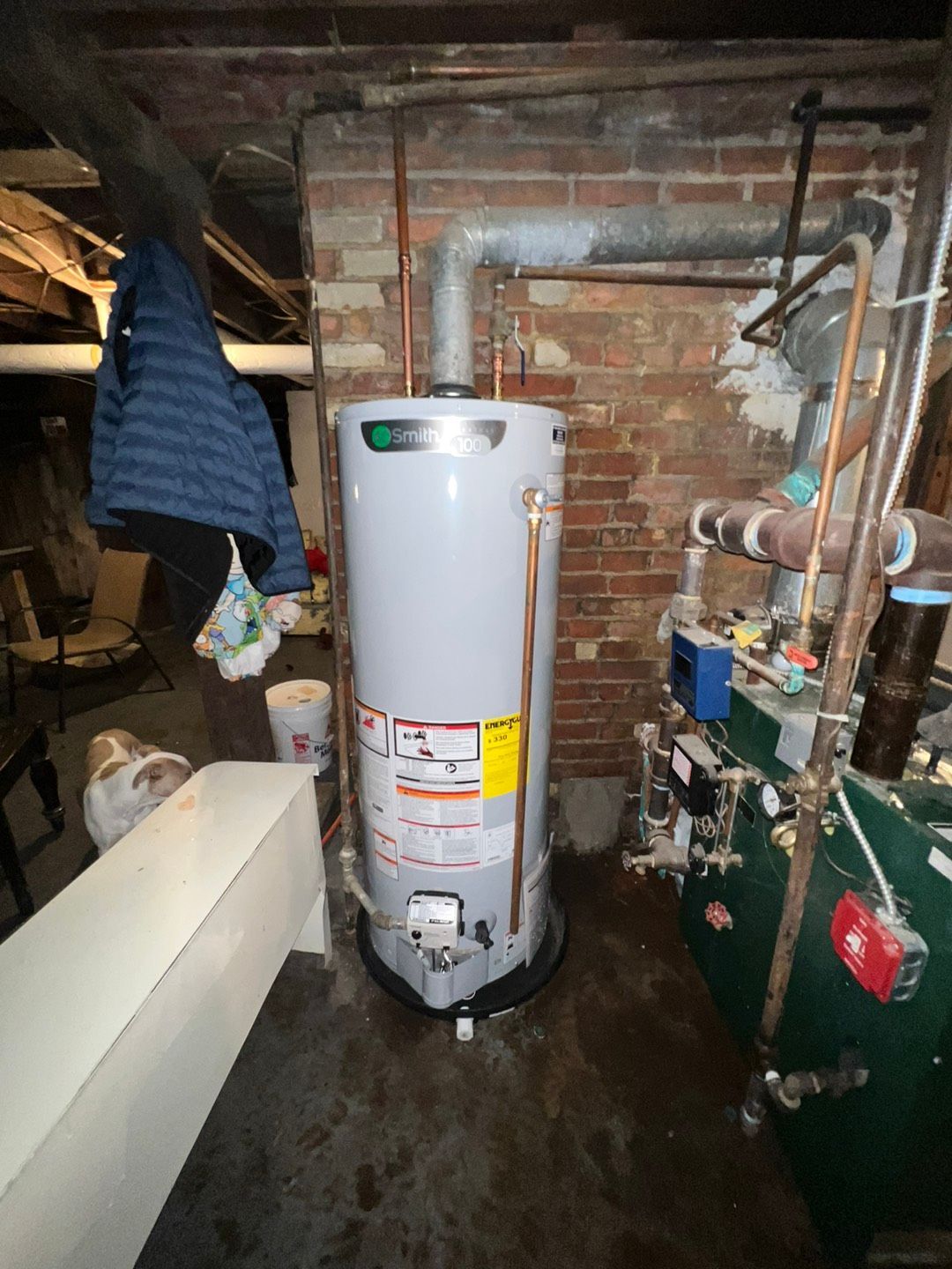 Water heater sitting in a basement next to a brick wall - Lafayette, NJ | Clear Water Solutions