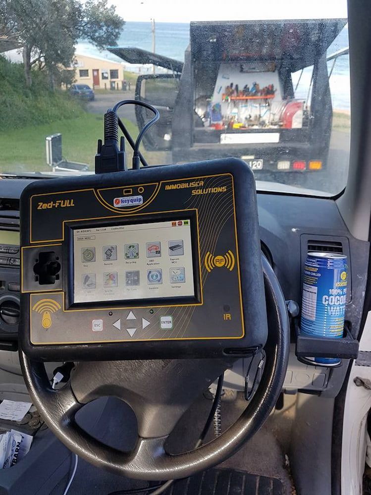 The Inside of a Car With a Tablet on the Steering Wheel — South Coast Locksmiths in Fairy Meadow, NSW