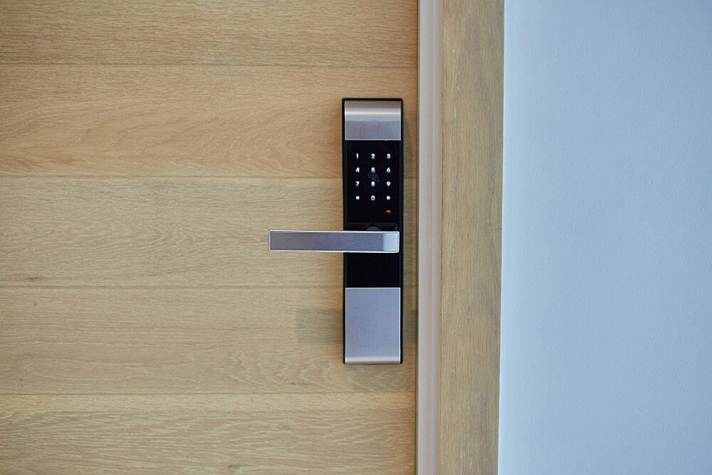 A Close Up of a Digital Door Lock on a Wooden Door — South Coast Locksmiths in Fairy Meadow, NSW