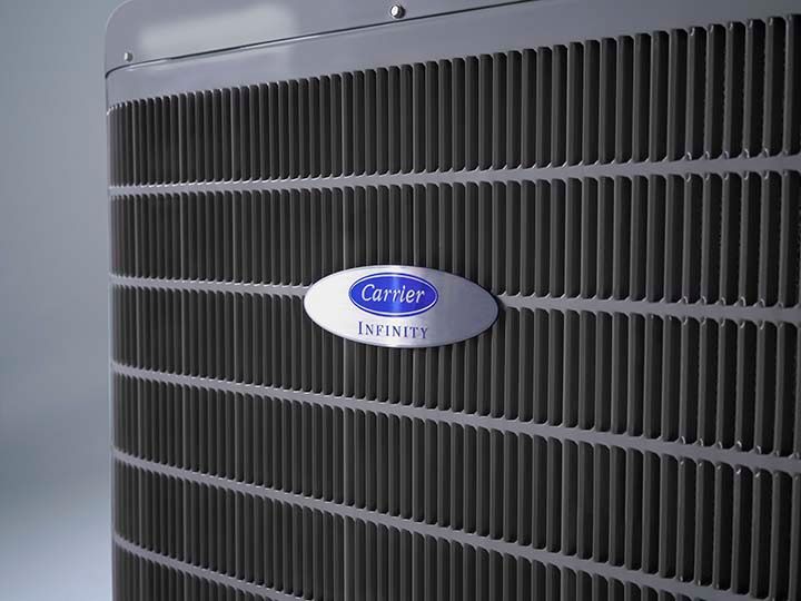 Carrier air conditioning unit, with logo on the front.